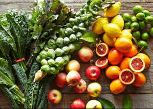 a group of fruits and vegetables on a wood surface Healthy Weight Loss Diets Felixstowe
