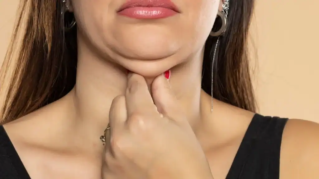 An image of a woman with double chin, sad, worried : Non Surgical Double Chin Removal Treatment in Felixstowe, UK